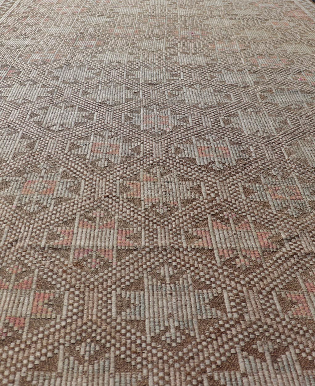 Measures: 5'2 x 9'3 Vintage Turkish Embroidered Kilim with All - Over Star Design on A Taupe Ground. Keivan Woven Arts / rug EN - 176232, country of origin / type: Turkey / Kilim, circa 1950 This vintage Kilim displays an array of designs, including... - Keivan Woven ArtsEN - 176232 - 21907Rug