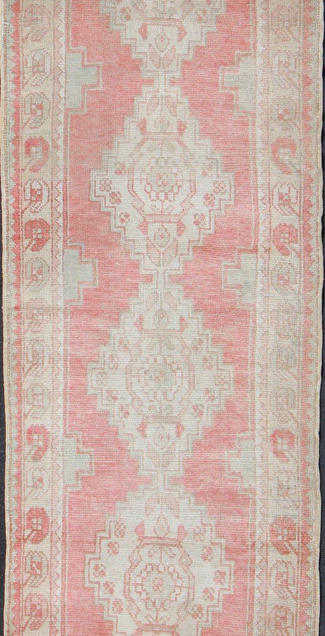 Vintage Turkish Oushak Runner with Multi - Medallion Design in Muted Red and Ivory Vintage Oushak Runner from Turkey with Vertical Medallion Design in Coral, Ivory, and Light Green, rug en - 176247, country of origin / type: Turkey / Oushak, circa 1... - Keivan Woven ArtsEN - 176247 - 10249Rug
