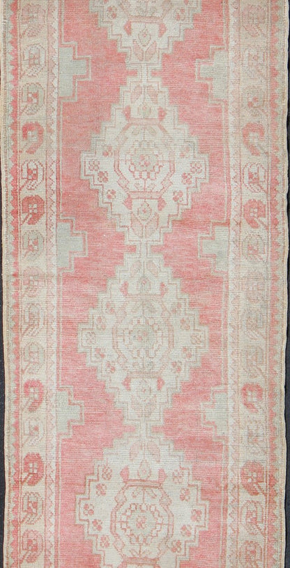 Vintage Turkish Oushak Runner with Multi - Medallion Design in Muted Red and Ivory Vintage Oushak Runner from Turkey with Vertical Medallion Design in Coral, Ivory, and Light Green, rug en - 176247, country of origin / type: Turkey / Oushak, circa 1... - Keivan Woven ArtsEN - 176247 - 10249Rug