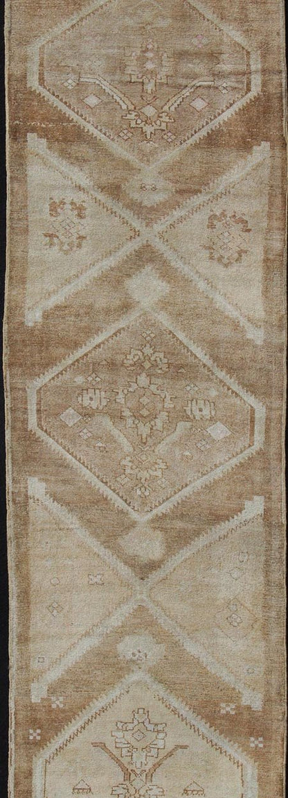 Vintage Turkish Oushak Runner Neutral and warm Colors with Tribal Medallions vintage Turkish Oushak runner in neutral colors with medallions in taupe, brown and light brown. rug/EN - 176561 Keivan Woven Arts / Vintage Oushak runner This vin... - Keivan Woven ArtsEN - 176561 - 11030Rug