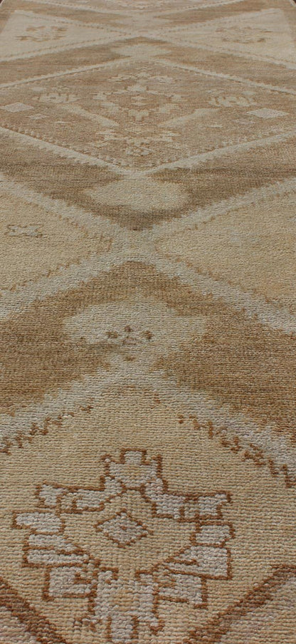Vintage Turkish Oushak Runner Neutral and warm Colors with Tribal Medallions vintage Turkish Oushak runner in neutral colors with medallions in taupe, brown and light brown. rug/EN - 176561 Keivan Woven Arts / Vintage Oushak runner This vin... - Keivan Woven ArtsEN - 176561 - 11030Rug
