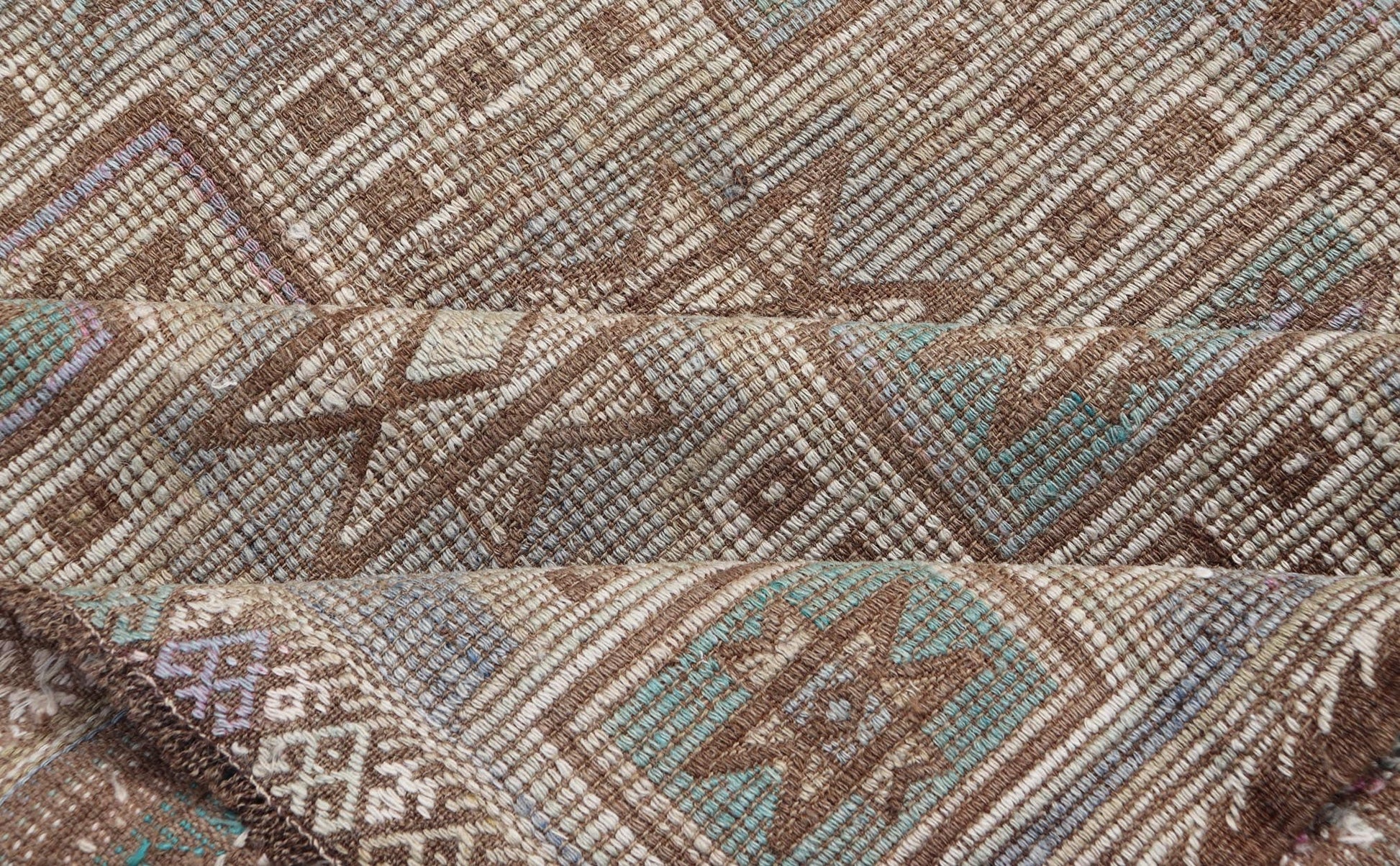 Vintage Turkish Embroidered Kilim in Light Green, Tan, and Hints of Lavender Measures: 5'0 x 9'8 This vintage flat weave Kilim was hand woven in Turkey during the 1950's. The light taupe field is decorated with tribal - like motifs, with ... - Keivan Woven ArtsEN - 176775 - 18878Rug