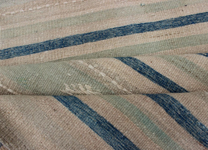 Vintage Turkish Kilim Runner With Stripes in Green, Gray and Cream Shades Measures: 2'8 x 10'1. This flat - woven Kilim runner from Turkey features an exciting composition consisting of stripes rendered in natural tones of brown, blue, and gray, a... - Keivan Woven ArtsEN - 176849 - 1 - 11229Rug