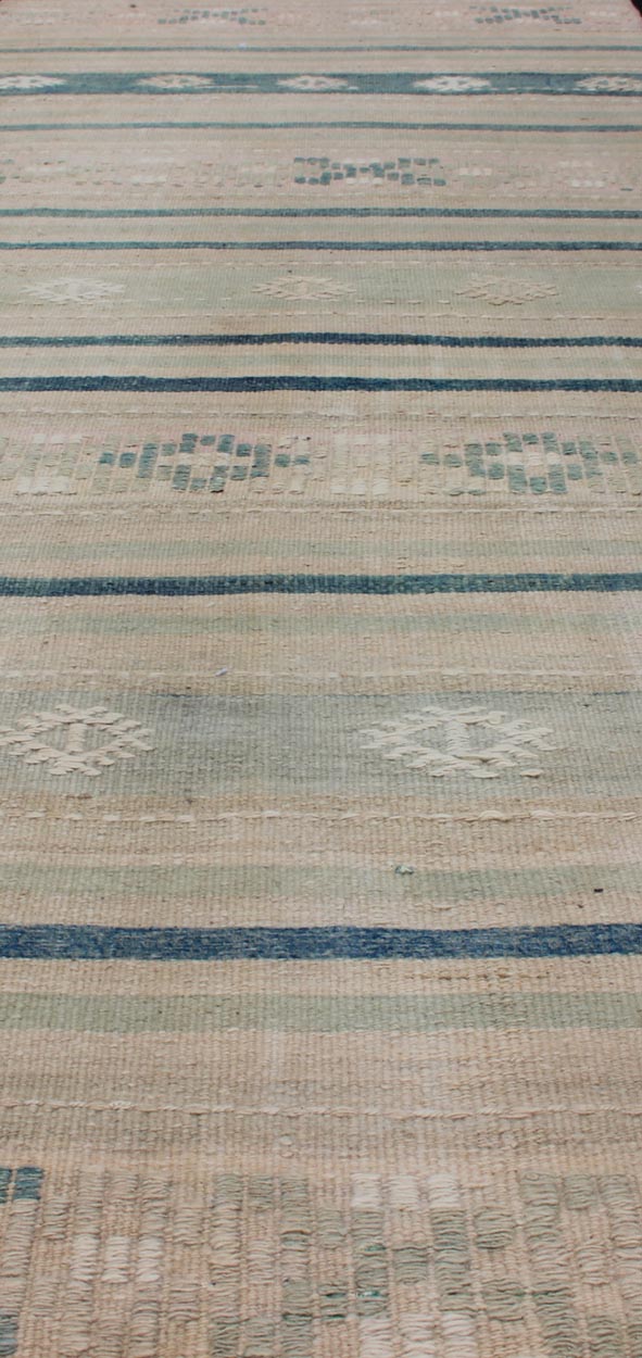 Vintage Turkish Kilim Runner With Stripes in Green, Gray and Cream Shades Measures: 2'8 x 10'1. This flat - woven Kilim runner from Turkey features an exciting composition consisting of stripes rendered in natural tones of brown, blue, and gray, a... - Keivan Woven ArtsEN - 176849 - 1 - 11229Rug