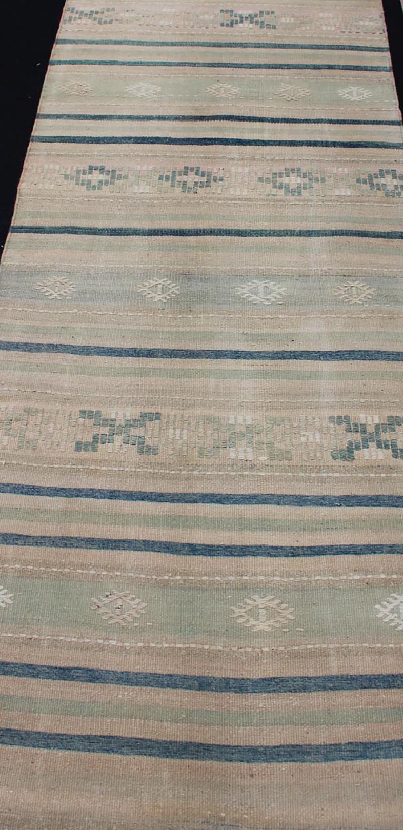 Vintage Turkish Kilim Runner With Stripes in Green, Gray and Cream Shades Measures: 2'8 x 10'1. This flat - woven Kilim runner from Turkey features an exciting composition consisting of stripes rendered in natural tones of brown, blue, and gray, a... - Keivan Woven ArtsEN - 176849 - 1 - 11229Rug