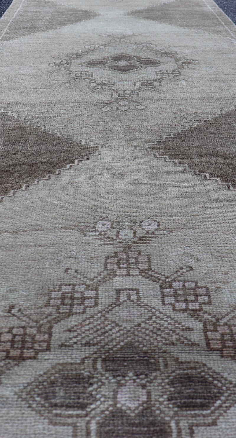 Measures: 2'10 x 13'3 Vintage Turkish Oushak Runner Neutral and Warm Colors with Tribal Medallions. rug/EN - 176926 Keivan Woven Arts / Vintage Oushak runner. Turkey mid20th century. This vintage Oushak carpet from mid - 20th century Turkey feature... - Keivan Woven ArtsEN - 176926 - 21712Rug