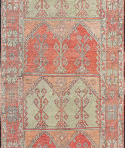 Gallery Rug, Vintage Turkish in Faded Red, Coral, Orange, Soft Pink and Green. Turkish gallery rug with faded colors, rug EN - 178032, country of origin / type: Turkey / Oushak, circa 1940 This fun and vibrant Oushak runner from 1930s feat... - Keivan Woven ArtsEN - 178032 - 14242Rug