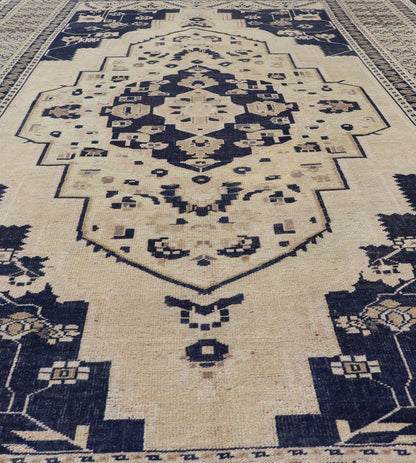 Vintage Hand - Knotted Turkish Oushak in Wool with Sub - Geometric Medallion Design This vintage Turkish Oushak rug has been hand - knotted in wool and features a large central medallion design rendered in blue, cream, tan and ivory tones. A compleme... - Keivan Woven ArtsEN - 178064 - 19508