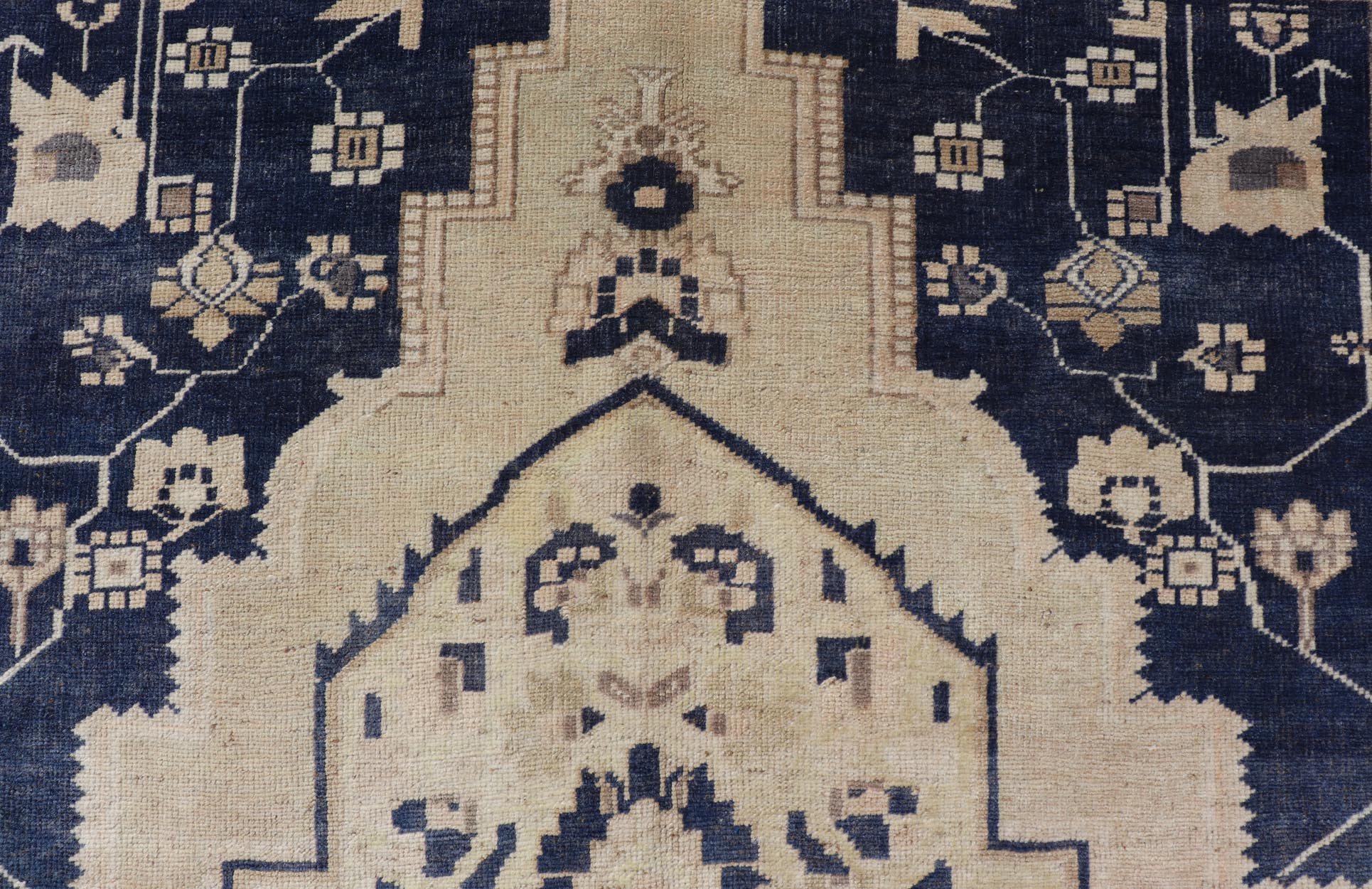 Vintage Hand - Knotted Turkish Oushak in Wool with Sub - Geometric Medallion Design This vintage Turkish Oushak rug has been hand - knotted in wool and features a large central medallion design rendered in blue, cream, tan and ivory tones. A compleme... - Keivan Woven ArtsEN - 178064 - 19508