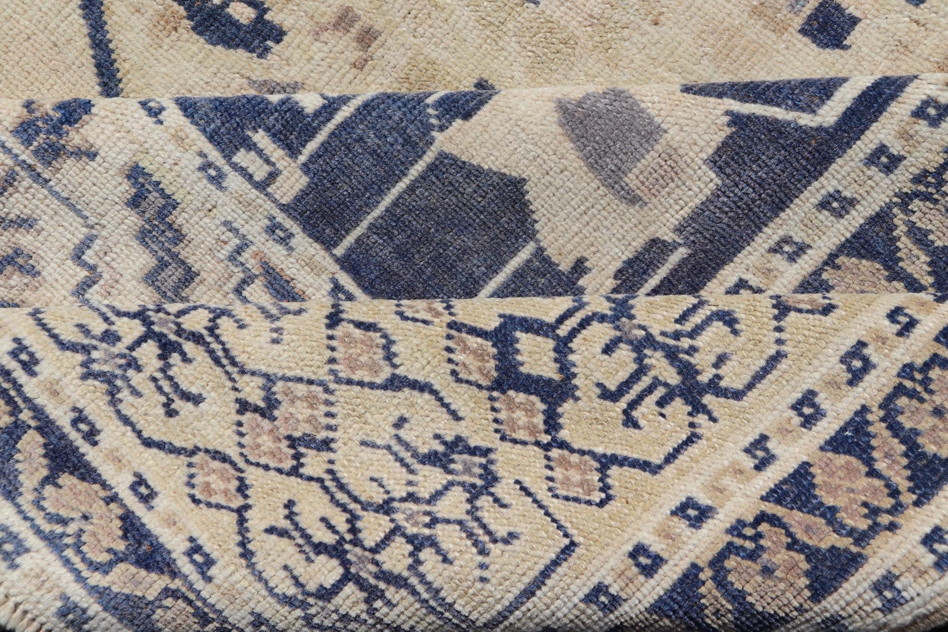 Vintage Hand - Knotted Turkish Oushak in Wool with Sub - Geometric Medallion Design This vintage Turkish Oushak rug has been hand - knotted in wool and features a large central medallion design rendered in blue, cream, tan and ivory tones. A compleme... - Keivan Woven ArtsEN - 178064 - 19508