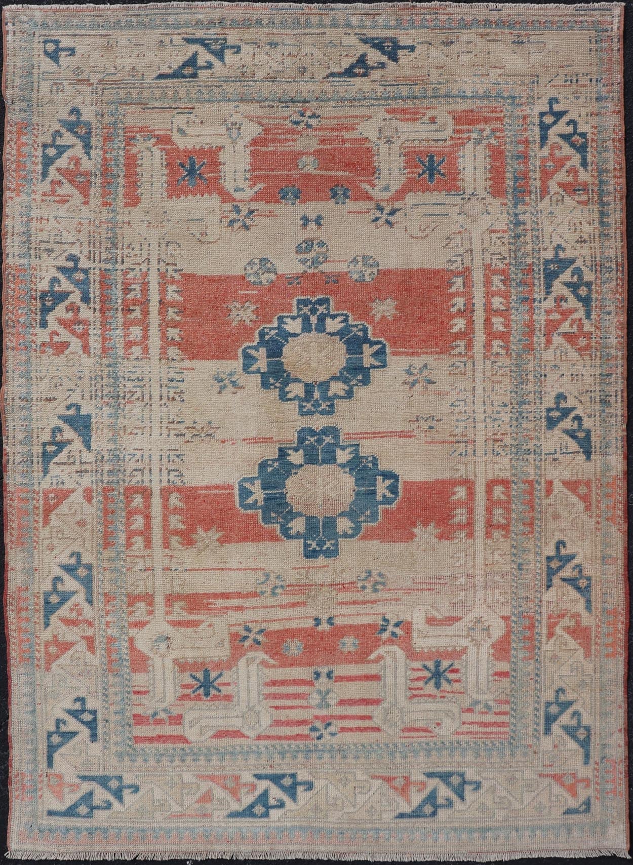 Tribal Medallion Design Vintage Turkish Oushak in Cream, Blue, and Terracotta Measures: 4'5 x 6'7 This vintage Oushak has repeating motifs in terracotta, cream, and blue encasing multiple motifs and the striped field. The eccentric fiel... - Keivan Woven ArtsEN - 178200 - 18884Rug