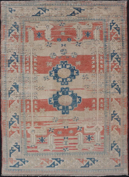 Tribal Medallion Design Vintage Turkish Oushak in Cream, Blue, and Terracotta Measures: 4'5 x 6'7 This vintage Oushak has repeating motifs in terracotta, cream, and blue encasing multiple motifs and the striped field. The eccentric fiel... - Keivan Woven ArtsEN - 178200 - 18884Rug