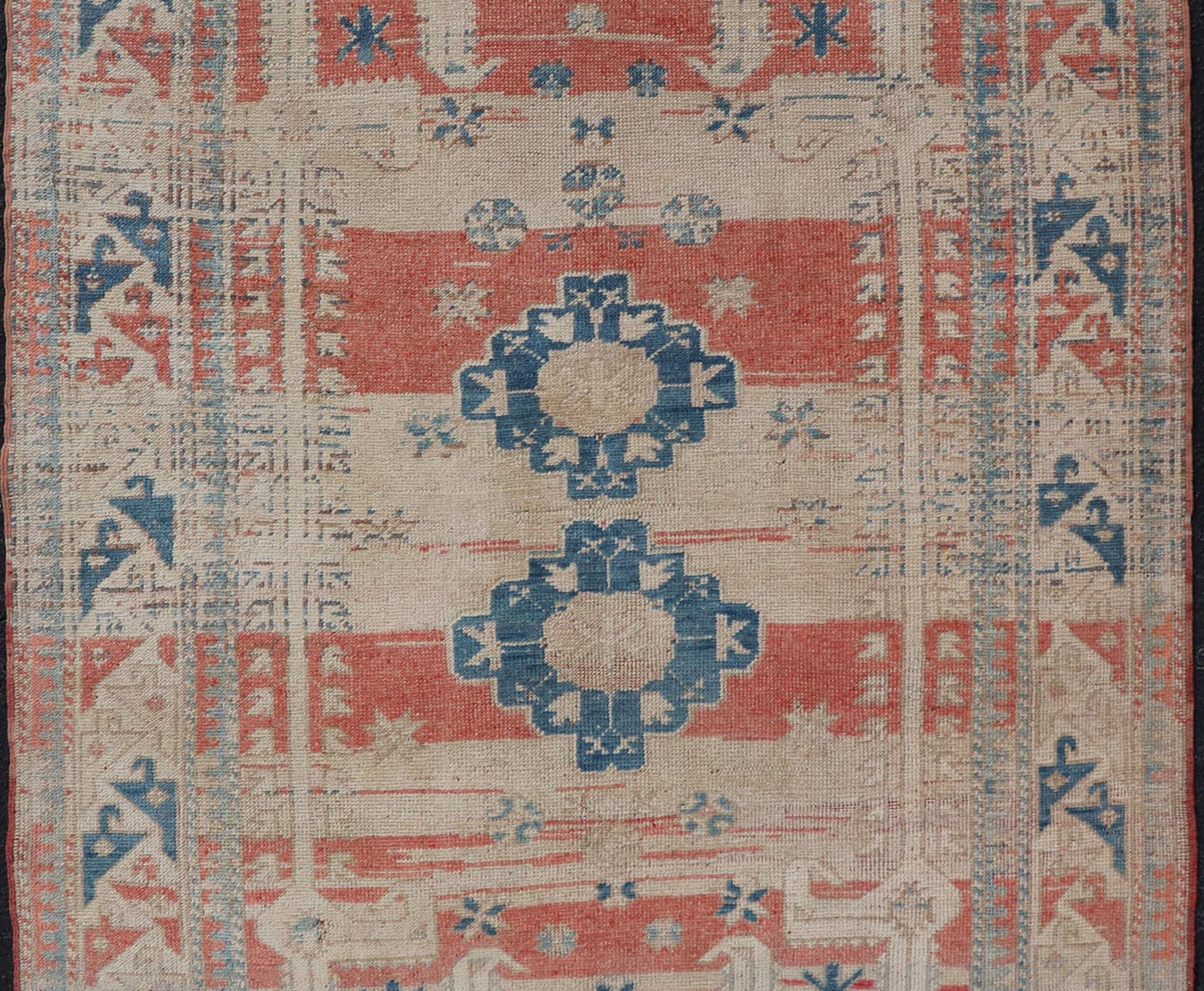 Tribal Medallion Design Vintage Turkish Oushak in Cream, Blue, and Terracotta Measures: 4'5 x 6'7 This vintage Oushak has repeating motifs in terracotta, cream, and blue encasing multiple motifs and the striped field. The eccentric fiel... - Keivan Woven ArtsEN - 178200 - 18884Rug