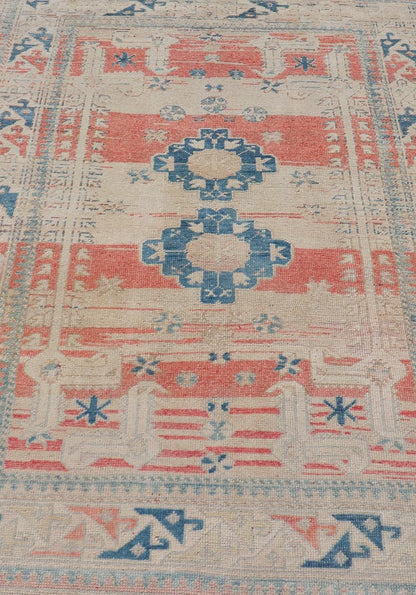 Tribal Medallion Design Vintage Turkish Oushak in Cream, Blue, and Terracotta Measures: 4'5 x 6'7 This vintage Oushak has repeating motifs in terracotta, cream, and blue encasing multiple motifs and the striped field. The eccentric fiel... - Keivan Woven ArtsEN - 178200 - 18884Rug