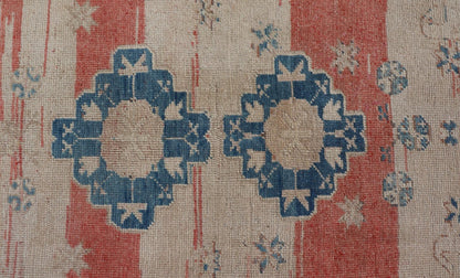 Tribal Medallion Design Vintage Turkish Oushak in Cream, Blue, and Terracotta Measures: 4'5 x 6'7 This vintage Oushak has repeating motifs in terracotta, cream, and blue encasing multiple motifs and the striped field. The eccentric fiel... - Keivan Woven ArtsEN - 178200 - 18884Rug