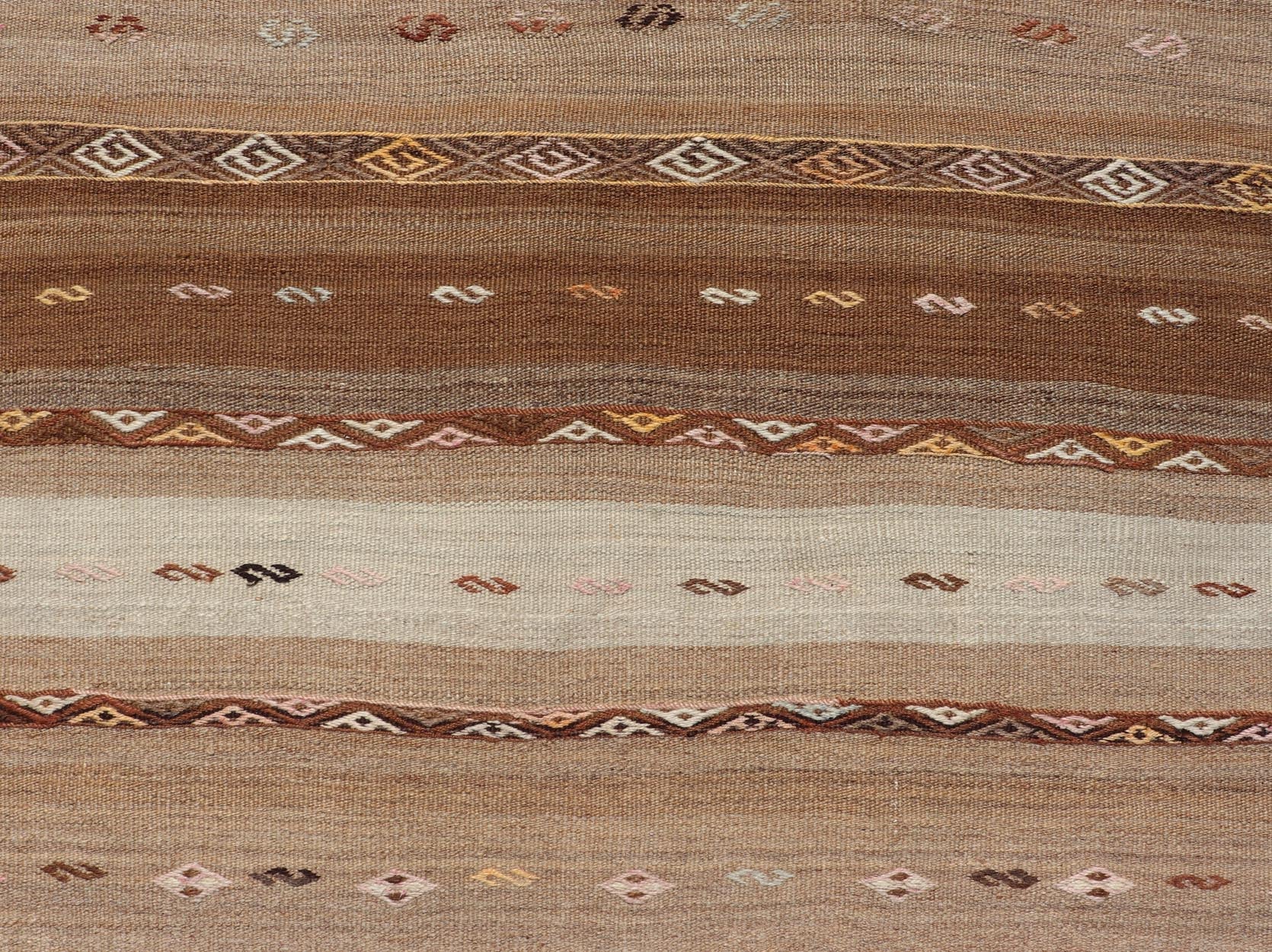 Vintage Earthy Kilim Gallery Runner with Stripe Design in Multi Colors & Motif's. Keivan Woven Arts / rug EN - 178669, country of origin / type: Turkey / Kilim, circa 1950. Measures: 4'6 x 11'7 Featuring a striking stripe design, this unique mid - c... - Keivan Woven ArtsEN - 178669 - 23504Rug