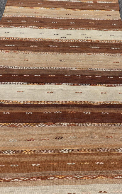 Vintage Earthy Kilim Gallery Runner with Stripe Design in Multi Colors & Motif's. Keivan Woven Arts / rug EN - 178669, country of origin / type: Turkey / Kilim, circa 1950. Measures: 4'6 x 11'7 Featuring a striking stripe design, this unique mid - c... - Keivan Woven ArtsEN - 178669 - 23504Rug
