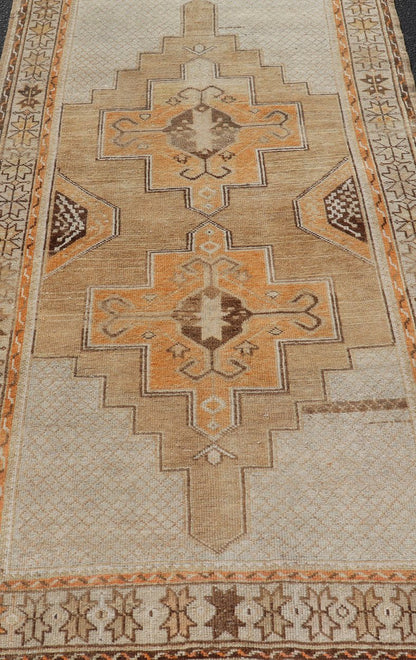 Vintage Turkish Oushak Rug With Medallions in Earthy Color Tones With Orange. Keivan Woven Arts / rug EN - 178670, country of origin / type: Turkey / Oushak, circa 1940 This vintage Oushak carpet from Turkey has center medallions in light blue and... - Keivan Woven ArtsEN - 178670 - 17496Rug