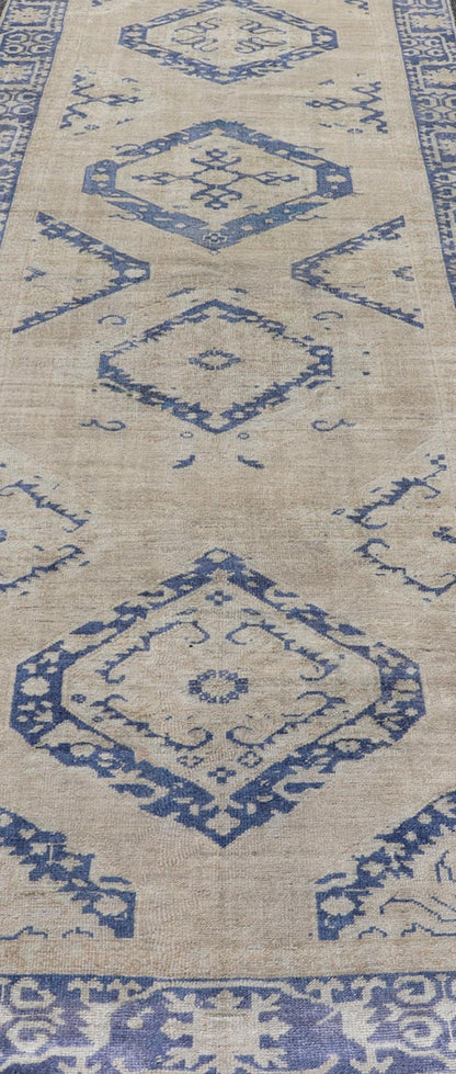 Turkish Oushak Gallery Rug in Blue and Cream with Geometric Design Measures: 4'6 x 12'6 This vintage Oushak gallery runner features blue medallions on a sandy - taupe field. The border and central medallions are both rendered in a rich me... - Keivan Woven ArtsEN - 178699 - 18896Rug