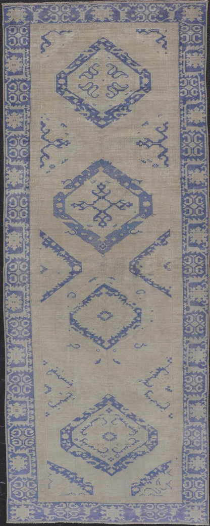 Turkish Oushak Gallery Rug in Blue and Cream with Geometric Design Measures: 4'6 x 12'6 This vintage Oushak gallery runner features blue medallions on a sandy - taupe field. The border and central medallions are both rendered in a rich me... - Keivan Woven ArtsEN - 178699 - 18896Rug