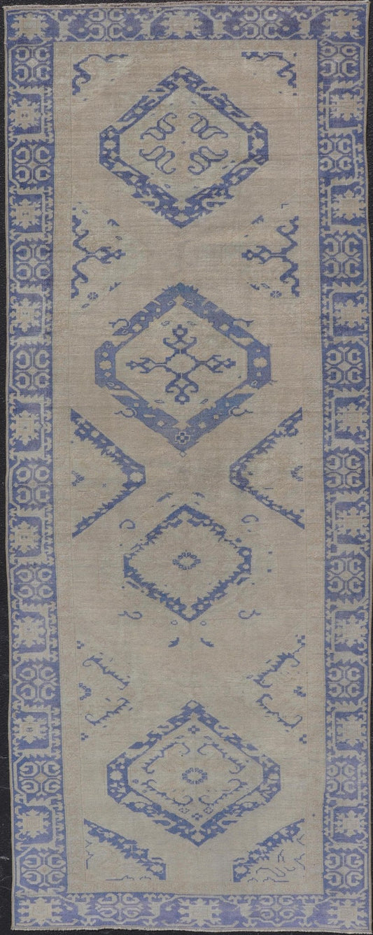 Turkish Oushak Gallery Rug in Blue and Cream with Geometric Design Measures: 4'6 x 12'6 This vintage Oushak gallery runner features blue medallions on a sandy - taupe field. The border and central medallions are both rendered in a rich me... - Keivan Woven ArtsEN - 178699 - 18896Rug