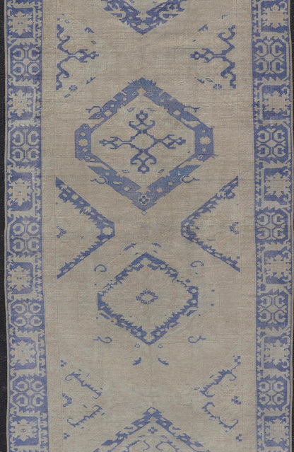 Turkish Oushak Gallery Rug in Blue and Cream with Geometric Design Measures: 4'6 x 12'6 This vintage Oushak gallery runner features blue medallions on a sandy - taupe field. The border and central medallions are both rendered in a rich me... - Keivan Woven ArtsEN - 178699 - 18896Rug
