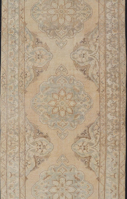 Measures: 4'3 x 11'7 Vintage Turkish Gallery Rug in Earth Tones & Light Grey with Floral Medallions. Keivan Woven Arts / Rug / EN - 178758, Keivan Woven Arts / country of origin / type: Turkey / Oushak, circa 1940. This beautiful vintage Ousha... - Keivan Woven ArtsEN - 178758 - 21925Rug