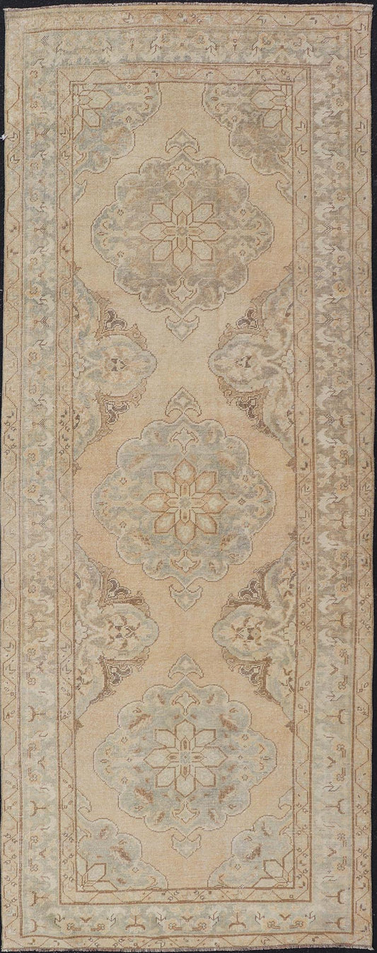 Measures: 4'3 x 11'7 Vintage Turkish Gallery Rug in Earth Tones & Light Grey with Floral Medallions. Keivan Woven Arts / Rug / EN - 178758, Keivan Woven Arts / country of origin / type: Turkey / Oushak, circa 1940. This beautiful vintage Ousha... - Keivan Woven ArtsEN - 178758 - 21925