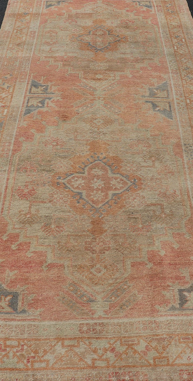 Vintage Turkish Oushak Gallery Rug with Tribal Medallion Design Variegated Red. Keivan Woven Arts / rug EN - 178760, country of origin / type: Turkey / Oushak, circa 1940 This vintage Turkish Oushak gallery runner features two large medallions expandi... - Keivan Woven ArtsEN - 178760 - 17508Rug
