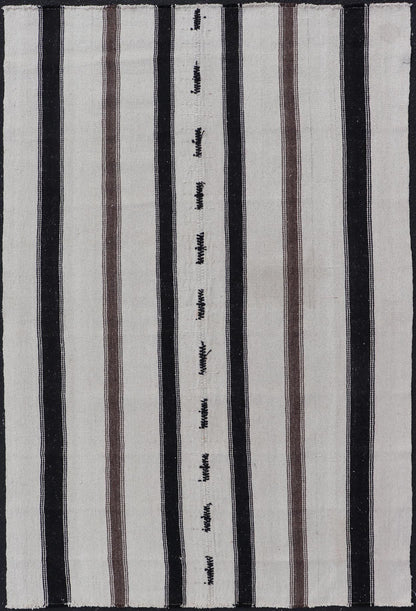 Vintage Turkish Kilim with Stripes in Ivory and Shades of Brown Measures 4'4 x 6'10 This vintage Turkish Kilim features simple design and neutral colors, giving these types of rugs a rise in popularity in modern interiors of the 2020's. ... - Keivan Woven ArtsEN - 178921 - 18902Rug