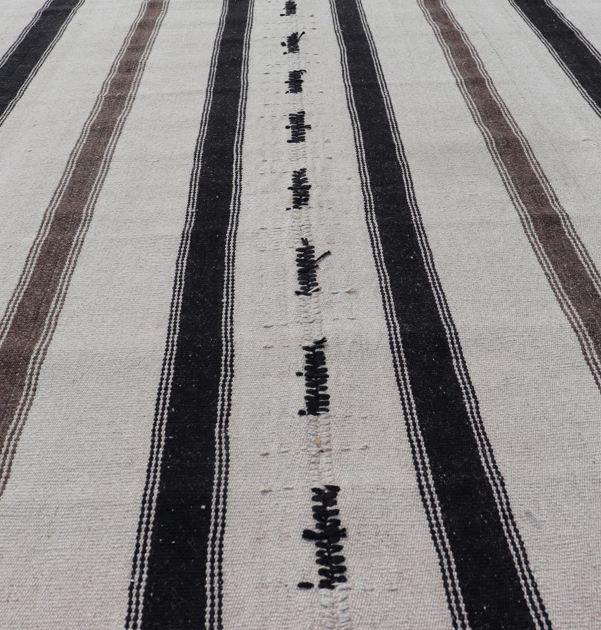 Vintage Turkish Kilim with Stripes in Ivory and Shades of Brown Measures 4'4 x 6'10 This vintage Turkish Kilim features simple design and neutral colors, giving these types of rugs a rise in popularity in modern interiors of the 2020's. ... - Keivan Woven ArtsEN - 178921 - 18902Rug