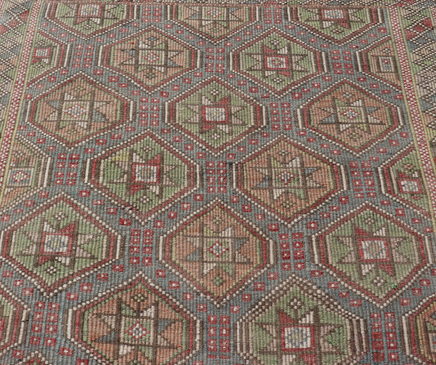 Colorful Vintage Turkish Flat - Weave Tribal Motif Kilim with Embroideries Colorful Vintage Turkish Flat - Weave Tribal Motif Kilim with Embroideries. Keivan Woven Arts / rug /EN - 178922 Mid - 20th Century This Embroidered kilim rug from Turkey... - Keivan Woven ArtsEN - 178922 - 17538Rug