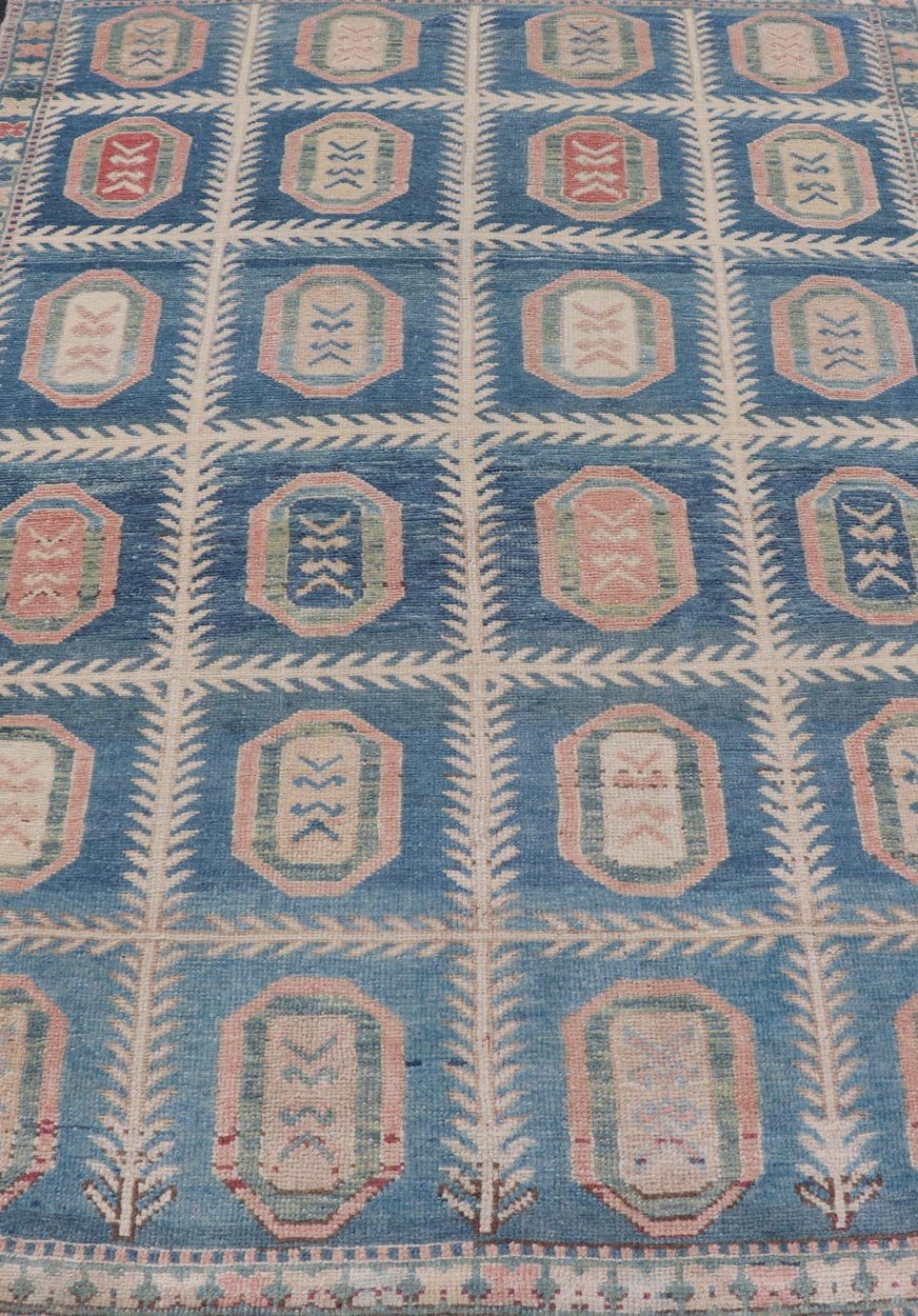 Vintage Hand - Knotted Turkish Tulu Rug in Wool with All - Over Medallion Design This vintage Turkish Tulu rug has been hand - knotted in wool and features an all - over sub - geometric medallion design rendered in multicolor. A complementary, multi - tier... - Keivan Woven ArtsEN - 178934 - 19850Rug