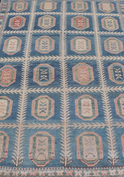 Vintage Hand - Knotted Turkish Tulu Rug in Wool with All - Over Medallion Design This vintage Turkish Tulu rug has been hand - knotted in wool and features an all - over sub - geometric medallion design rendered in multicolor. A complementary, multi - tier... - Keivan Woven ArtsEN - 178934 - 19850Rug
