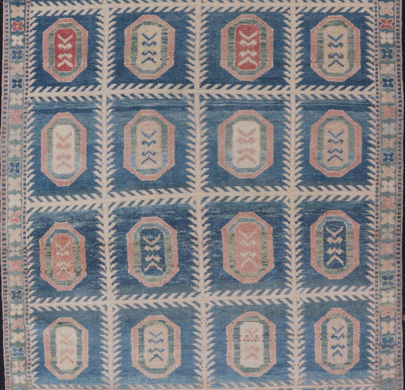 Vintage Hand - Knotted Turkish Tulu Rug in Wool with All - Over Medallion Design This vintage Turkish Tulu rug has been hand - knotted in wool and features an all - over sub - geometric medallion design rendered in multicolor. A complementary, multi - tier... - Keivan Woven ArtsEN - 178934 - 19850Rug