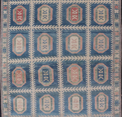 Vintage Hand - Knotted Turkish Tulu Rug in Wool with All - Over Medallion Design This vintage Turkish Tulu rug has been hand - knotted in wool and features an all - over sub - geometric medallion design rendered in multicolor. A complementary, multi - tier... - Keivan Woven ArtsEN - 178934 - 19850Rug