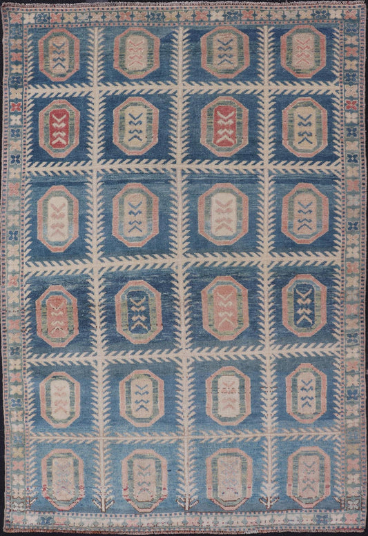 Vintage Hand - Knotted Turkish Tulu Rug in Wool with All - Over Medallion Design This vintage Turkish Tulu rug has been hand - knotted in wool and features an all - over sub - geometric medallion design rendered in multicolor. A complementary, multi - tier... - Keivan Woven ArtsEN - 178934 - 19850Rug
