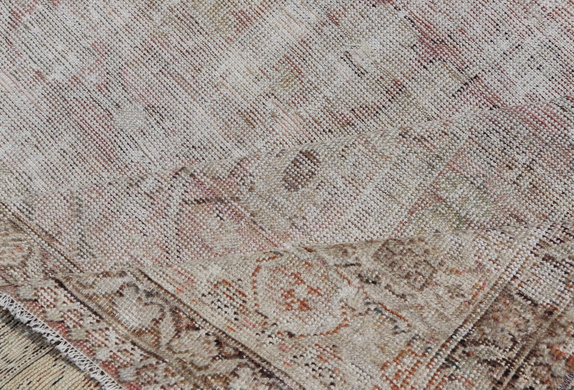 Distressed Antique Hand - Knotted Persian Mahal Rug in Wool in Neutral Tones This antique Persian Mahal rug has been hand - knotted in wool and features an all - over sub - geometric design rendered in neutral tones. A complementary, multi - tiered borde... - Keivan Woven ArtsEN - 178980 - 19856Rug
