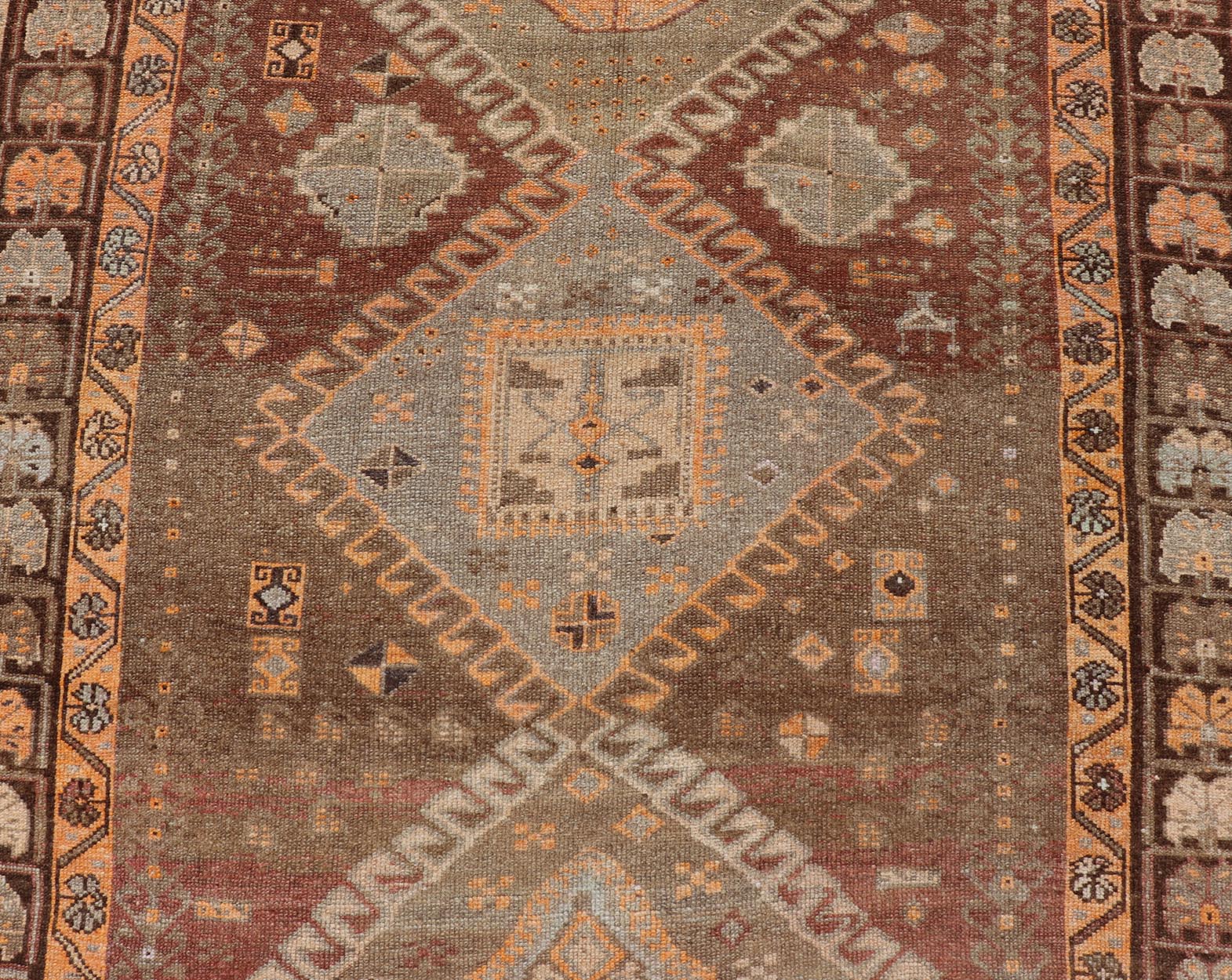 Vintage Hand Knotted Turkish Kars Gallery Rug in Wool with Diamond Design This antique Turkish Kars rug has been hand - knotted in wool and features an all - over, sub - geometric diamond design rendered in orange and earthy tones. A complementary, m... - Keivan Woven ArtsEN - 178983 - 19844