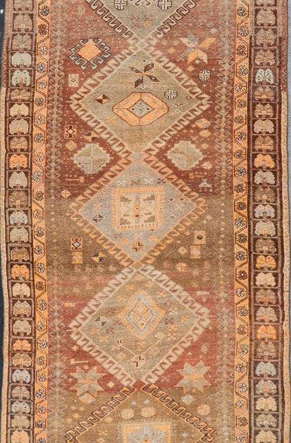 Vintage Hand Knotted Turkish Kars Gallery Rug in Wool with Diamond Design This antique Turkish Kars rug has been hand - knotted in wool and features an all - over, sub - geometric diamond design rendered in orange and earthy tones. A complementary, m... - Keivan Woven ArtsEN - 178983 - 19844
