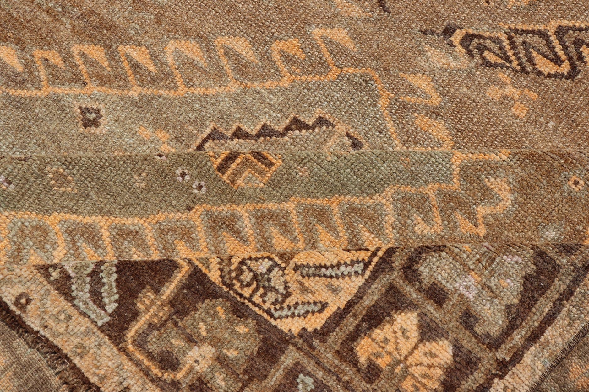 Vintage Hand Knotted Turkish Kars Gallery Rug in Wool with Diamond Design This antique Turkish Kars rug has been hand - knotted in wool and features an all - over, sub - geometric diamond design rendered in orange and earthy tones. A complementary, m... - Keivan Woven ArtsEN - 178983 - 19844