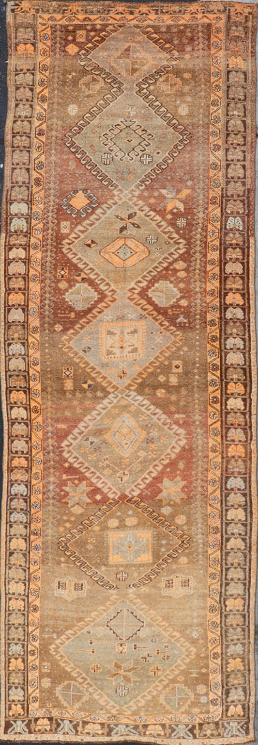 Vintage Hand Knotted Turkish Kars Gallery Rug in Wool with Diamond Design This antique Turkish Kars rug has been hand - knotted in wool and features an all - over, sub - geometric diamond design rendered in orange and earthy tones. A complementary, m... - Keivan Woven ArtsEN - 178983 - 19844