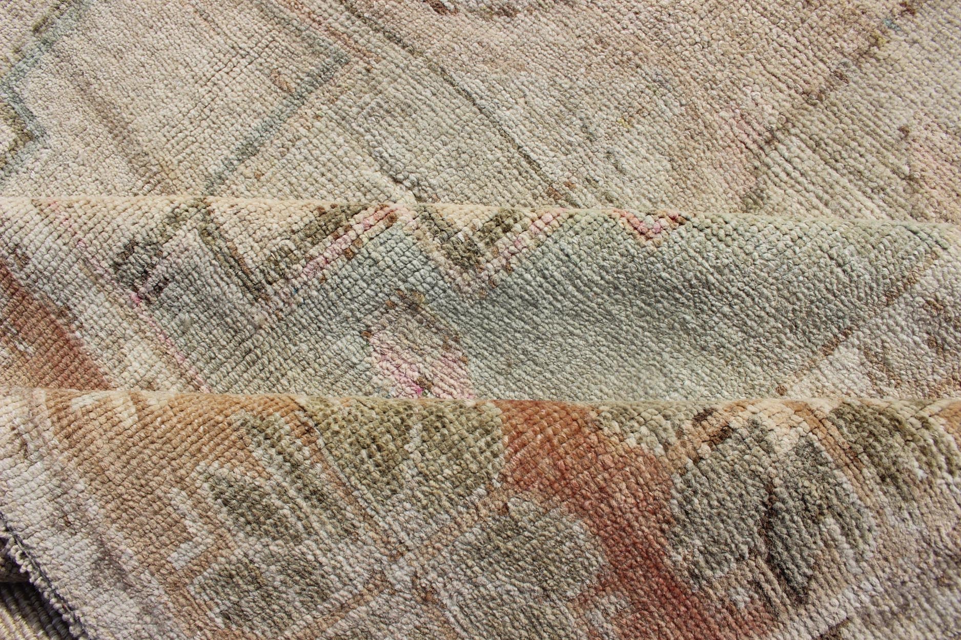 Oushak Vintage Rug with Pastel Colors in Tan, Brown, Butter, Peach, Lt. Blue. Light color Vintage Oushak rug with Central Medallions in Faded colors and medallion geometric design. Rug EN - 179021, country of origin / type: Turkey / Oushak, circa... - Keivan Woven ArtsEN - 179021 - 12541Rug