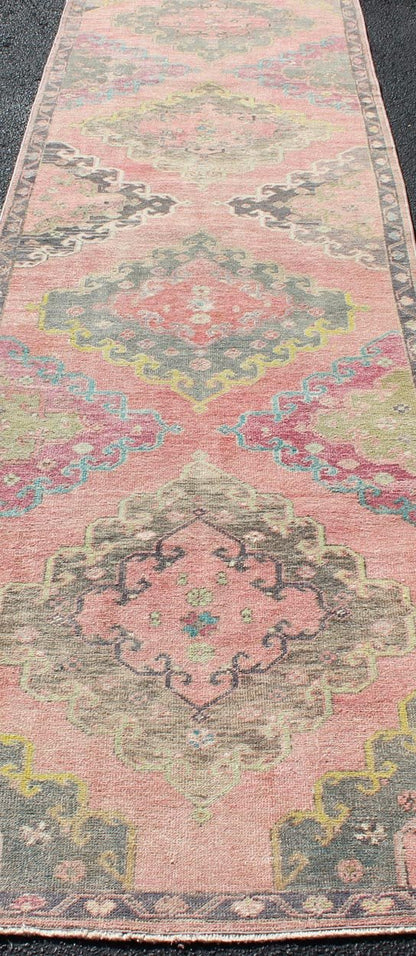 Colorful Vintage Turkish Oushak Runner with Four Medallion Design in Muted Colors. Measures: 3'4 x 12'3. This vintage Turkish Oushak runner features four layered medallions expanding across the central field. The surrounding border featu... - Keivan Woven ArtsEN - 179063 - 12349Rug