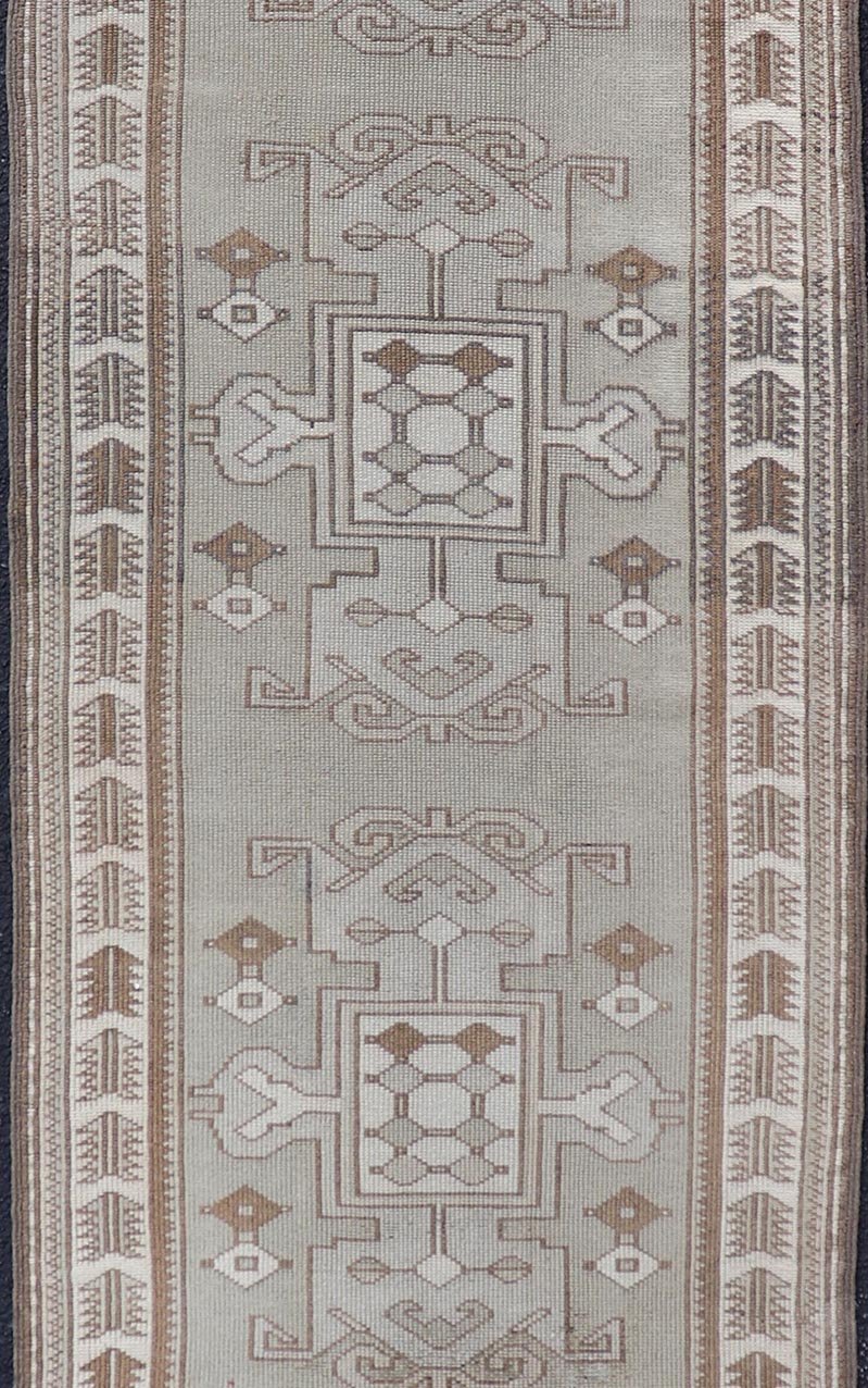 Measures: 2'10 x 10'0 Vintage Turkish Oushak Runner in Neutral Tones, Taupe, Gray, Cream, and Brown. Keivan Woven Arts / rug EN - 179108, country of origin / type: Turkey / Oushak, circa mid - 20th. This vintage Oushak carpet from mid - 20th century T... - Keivan Woven ArtsEN - 179108 - 21943Rug