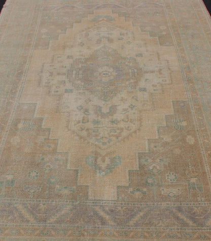 Faded Turkish Hand Knotted Oushak With Medallion With Muted Colors of Tan, Muted Light Peach Faded vintage Turkish Oushak Medallion rug in taupe, tan and light peach, kwarugs / EN - 179139, country of origin / type: Turkey / Oushak, circa mid - 20th... - Keivan Woven ArtsEN - 179139 - 11986Rug
