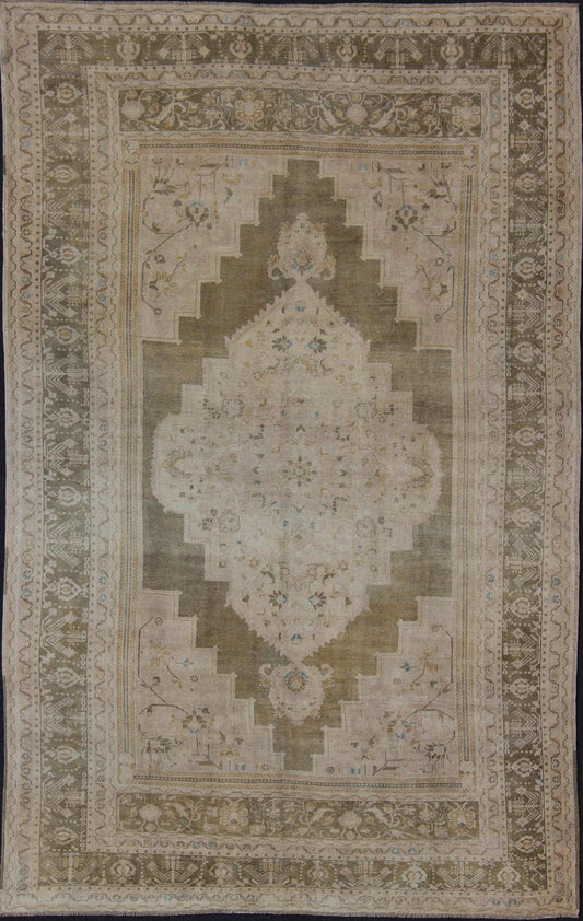 Medallion Vintage Turkish Oushak Rug in Olive Green, Army Green, Tan, Teal & Yellow and Muted Tones. Beautiful and unique color Turkish Oushak vintage in Olive and Army green background and border, and soft tones of tan. taupe, blush yellow and... - Keivan Woven ArtsEN - 179178 - 11992Rug