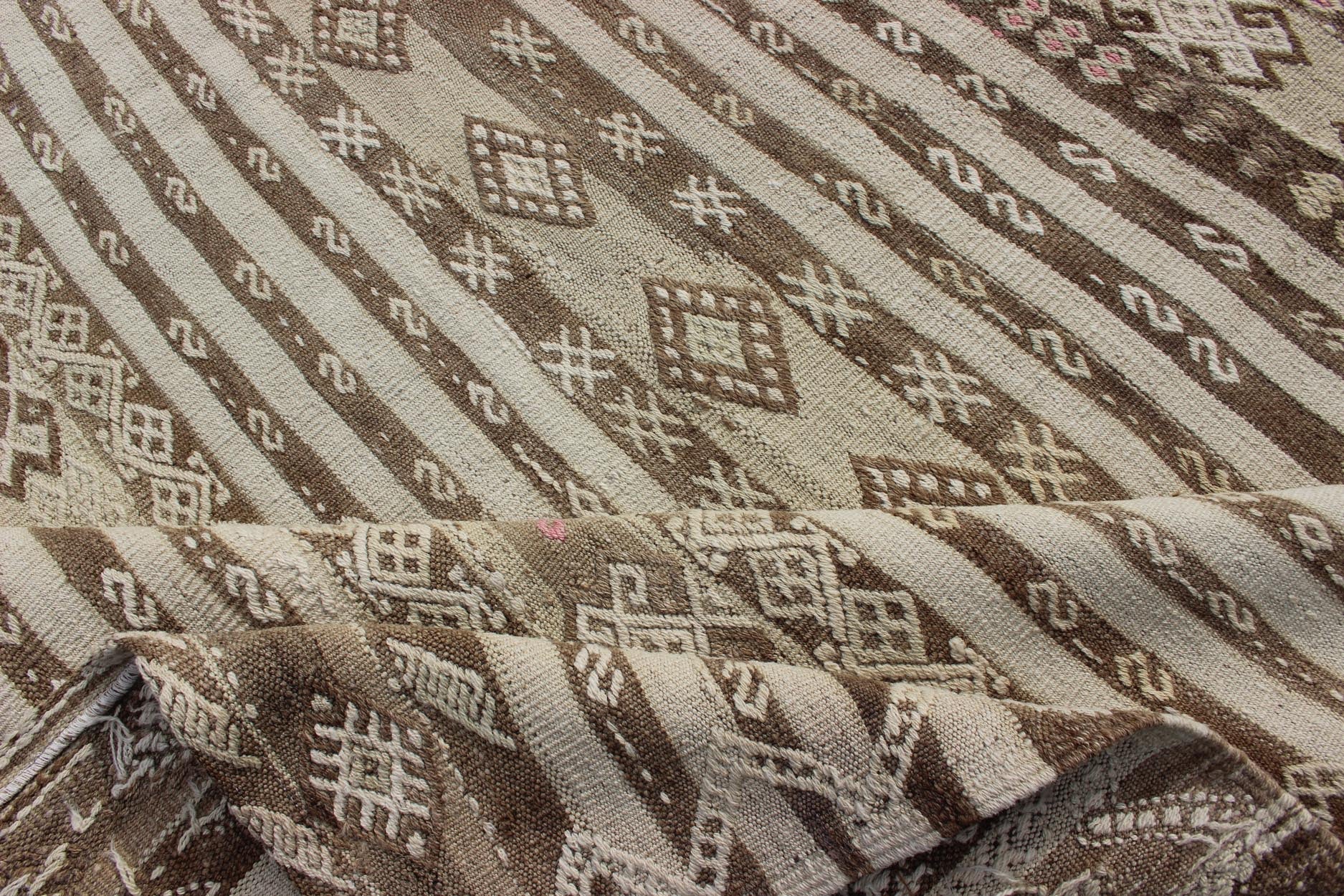 Tan and Pink Vintage Turkish Kilim Hand Woven in Wool Turkish Kilim vintage rug with assorted stripe design in a variety of colors, Keivan Woven Arts / rug en - 179230 country of origin / type: Turkey / Kilim, circa mid - 20th century. Featu... - Keivan Woven ArtsEN - 179230 - 12765Rug