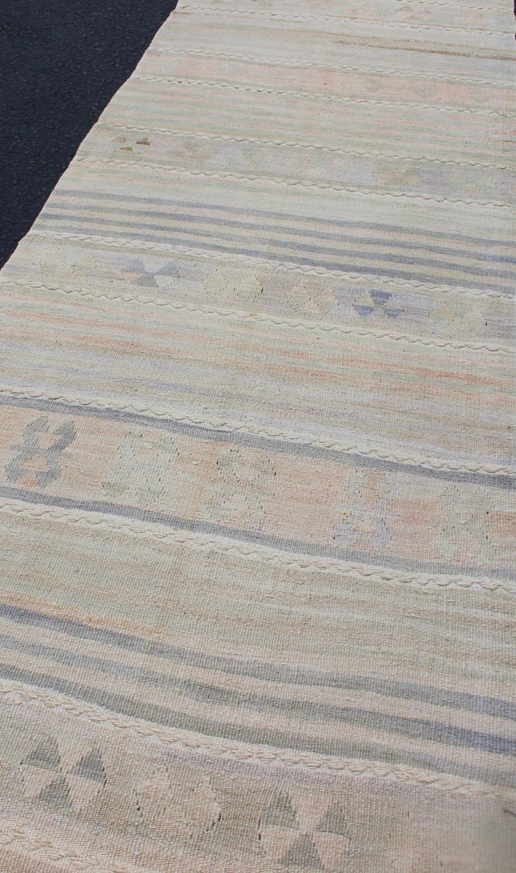 Vintage Turkish Kilim Runner with Soft Stripes and Modern Design in Muted Colors Vintage Turkish Kilim runner with a stripe and modern design in taupe, light pink, light green, slight blue tones and neutrals. Minimalist stripe design Kilim runne... - Keivan Woven ArtsEN - 179340 - 12006Rug