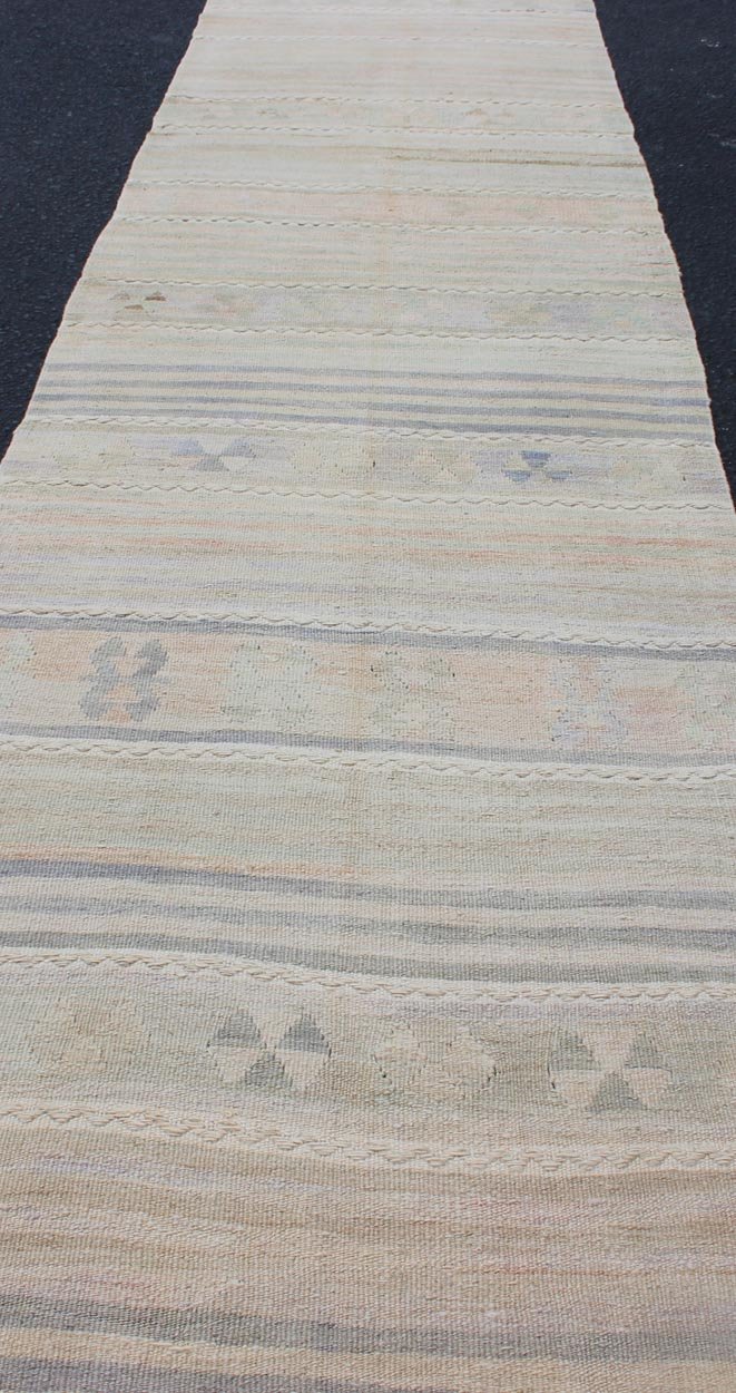 Vintage Turkish Kilim Runner with Soft Stripes and Modern Design in Muted Colors Vintage Turkish Kilim runner with a stripe and modern design in taupe, light pink, light green, slight blue tones and neutrals. Minimalist stripe design Kilim runne... - Keivan Woven ArtsEN - 179340 - 12006Rug